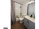 Modern bathroom with gray vanity, white subway tile, and bathtub at 1448 Old Jacksonville Rd, Waco, GA 30182