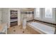 Bathroom featuring a soaking tub, a glass-door shower, and decorative windows at 37 Highcrest Dr, Acworth, GA 30101