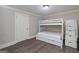 Neutral bedroom featuring a bunk bed with storage and wood-look floors at 37 Highcrest Dr, Acworth, GA 30101
