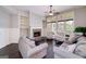 Comfortable living room featuring a stone fireplace, built-in shelves and large windows at 37 Highcrest Dr, Acworth, GA 30101