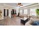 A cozy living room boasts wood floors, ceiling fan, and comfortable seating at 37 Highcrest Dr, Acworth, GA 30101