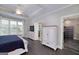 Spacious main bedroom with tray ceilings, a ceiling fan, hardwood floors, and a large window at 37 Highcrest Dr, Acworth, GA 30101