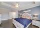 Bedroom features a tray ceiling, hardwood floors, and stylish furniture at 37 Highcrest Dr, Acworth, GA 30101