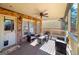 Covered patio area featuring wooden deck, ceiling fan, and comfortable furniture at 37 Highcrest Dr, Acworth, GA 30101