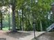 Front view of driveway, trees, street, and grassy area at 3746 Chapel Hill Road, Douglasville, GA 30135