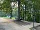 Front view of driveway, trees, street, and grassy area at 3746 Chapel Hill Road, Douglasville, GA 30135