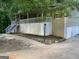 Home exterior featuring a charming porch, stairs, and two-car garage at 3746 Chapel Hill Road, Douglasville, GA 30135