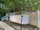 A house featuring a nice-sized porch with white railings and stairs leading to the front door at 3746 Chapel Hill Road, Douglasville, GA 30135