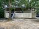 A house featuring a nice-sized front porch with white railings and stairs leading to the front door at 3746 Chapel Hill Road, Douglasville, GA 30135