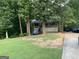 A house featuring a nice-sized front porch with white railings and stairs leading to the front door at 3746 Chapel Hill Road, Douglasville, GA 30135