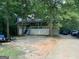 A house featuring a nice-sized front porch with white railings and stairs leading to the front door at 3746 Chapel Hill Road, Douglasville, GA 30135