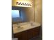Double vanity bathroom with large mirror and bright lighting at 3590 Stephens Creek Pl, Loganville, GA 30052