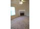 Living room featuring a fireplace and neutral carpet at 3590 Stephens Creek Pl, Loganville, GA 30052