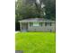 Charming single-story home with green lawn, neutral brick and welcoming front porch at 752 Jefferson Sw Ave, Atlanta, GA 30315