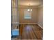 Inviting dining room features wood floors, natural light, and a modern chandelier at 752 Jefferson Sw Ave, Atlanta, GA 30315