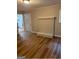 Cozy living room featuring hardwood floors, a decorative fireplace, and neutral paint at 752 Jefferson Sw Ave, Atlanta, GA 30315