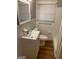 Neat bathroom with white fixtures, tiled walls, and natural lighting at 752 Jefferson Sw Ave, Atlanta, GA 30315