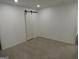 Spacious bedroom with neutral carpeting and barn door at 553 Highway 279, Fayetteville, GA 30214