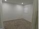 Well-lit bedroom featuring neutral walls and carpet at 553 Highway 279, Fayetteville, GA 30214