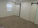 Bright bedroom with neutral carpeting and barn doors at 553 Highway 279, Fayetteville, GA 30214