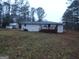 Ranch style home with deck and storage shed at 553 Highway 279, Fayetteville, GA 30214