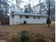 Back of house showing brick exterior and deck at 553 Highway 279, Fayetteville, GA 30214