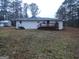 Ranch style home with deck and storage shed at 553 Highway 279, Fayetteville, GA 30214