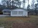 Ranch home with brick exterior and partial view of another home at 553 Highway 279, Fayetteville, GA 30214