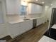 Well-equipped kitchen featuring white shaker cabinets and quartz countertops at 553 Highway 279, Fayetteville, GA 30214