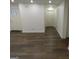 Spacious living area with laminate wood floors and an interior door at 553 Highway 279, Fayetteville, GA 30214