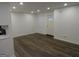Living room featuring dark laminate floors and recessed lighting at 553 Highway 279, Fayetteville, GA 30214