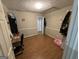 Bedroom featuring hardwood floors and a built in closet space at 220 Canterbury Ln, Lawrenceville, GA 30046