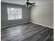 Spacious bedroom with new flooring and a ceiling fan at 356 Norhill Ct, Lawrenceville, GA 30046