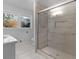 Bathroom with walk-in shower, updated fixtures, and gray tile at 215 Elliott Rd, Mcdonough, GA 30252