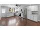 Modern kitchen with white cabinets, granite counters, and stainless steel appliances at 215 Elliott Rd, Mcdonough, GA 30252