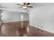Bright living room with hardwood floors, ceiling fan, and fireplace at 215 Elliott Rd, Mcdonough, GA 30252