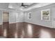Large main bedroom with hardwood floors, ceiling fan, and en-suite bathroom at 215 Elliott Rd, Mcdonough, GA 30252