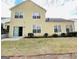 Spacious backyard featuring a patio, well-maintained lawn, and lush greenery at 144 Cottsford Sw Dr # 22, South Fulton, GA 30331