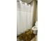 Full bathroom featuring a shower with curtain and a modern toilet at 144 Cottsford Sw Dr # 22, South Fulton, GA 30331