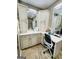 Vanity area featuring well-lit mirrors, cabinets and countertop space, and a makeup counter at 144 Cottsford Sw Dr # 22, South Fulton, GA 30331