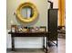 Bright entryway with a large gold mirror and console table at 144 Cottsford Sw Dr # 22, South Fulton, GA 30331