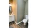 Neat half-bathroom with fresh white fixtures and neutral color scheme at 144 Cottsford Sw Dr # 22, South Fulton, GA 30331