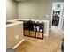Hallway with built in shelving and storage, and neutral color scheme at 144 Cottsford Sw Dr # 22, South Fulton, GA 30331