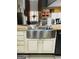 Kitchen with farmhouse sink and granite countertops at 144 Cottsford Sw Dr # 22, South Fulton, GA 30331