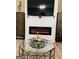 Modern living room featuring a sleek fireplace and glass coffee table at 144 Cottsford Sw Dr # 22, South Fulton, GA 30331