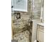 Tiled walk-in shower featuring a glass door and built-in shelving at 144 Cottsford Sw Dr # 22, South Fulton, GA 30331