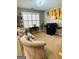 Bright sitting area featuring large windows, neutral tones, and artistic accents at 144 Cottsford Sw Dr # 22, South Fulton, GA 30331