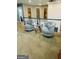 Cozy sitting area with swivel chairs, glass table, and artistic decor at 144 Cottsford Sw Dr # 22, South Fulton, GA 30331