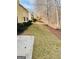 Serene backyard featuring a grassy slope and plenty of space for outdoor activities at 144 Cottsford Sw Dr # 22, South Fulton, GA 30331
