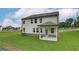 Beautiful backyard featuring a covered patio and spacious lawn at 376 Collier Mills Road, Lawrenceville, GA 30045